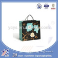 luxury design customized gift paper bag with beautiful flower printed wholesale OEM are accepted